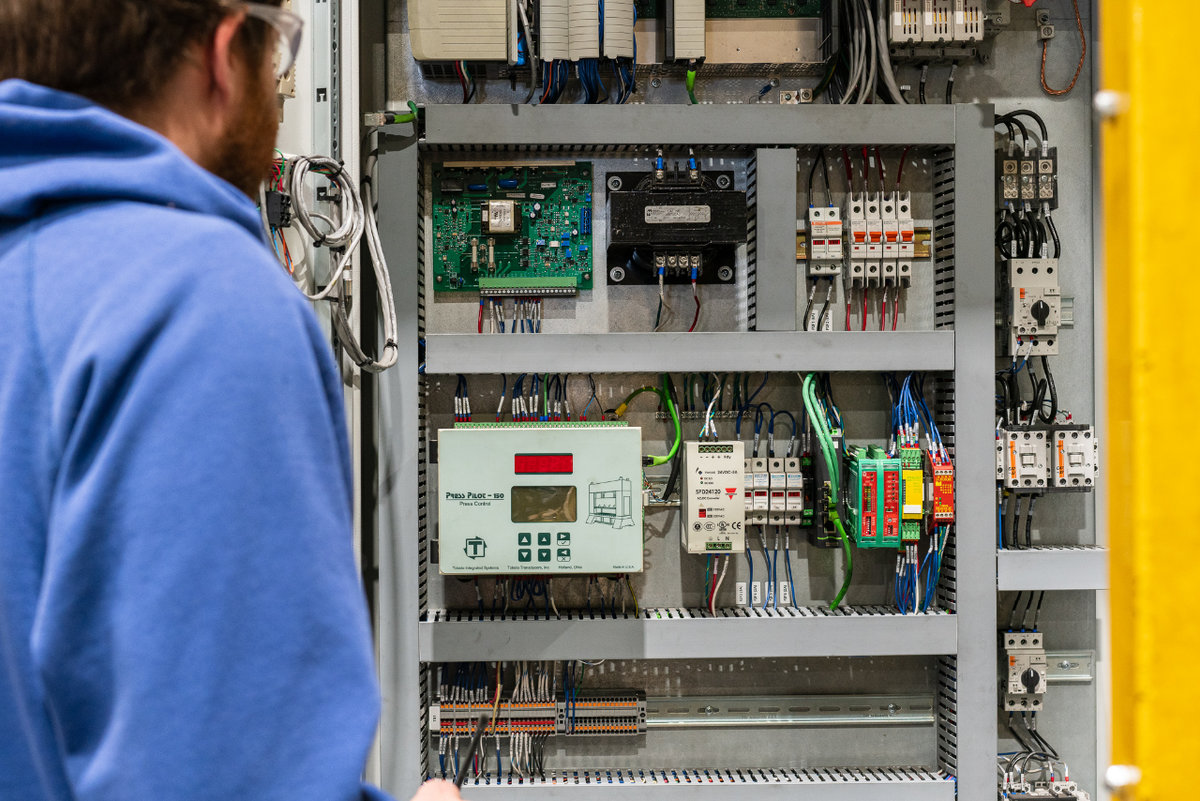 Globe Panel Shop Employee working on Electrical Panel